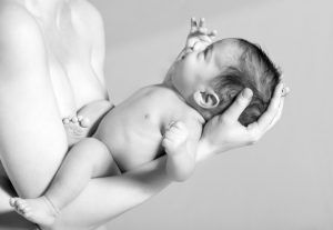 Newborn Baby on Mother's Arm